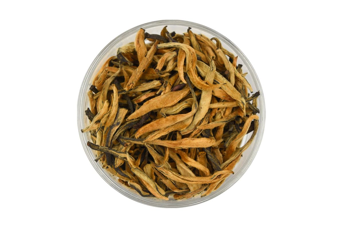 Long golden curls of early spring buds in this Yunnan Golden Buds loose tea from AVANTCHA platinum collection.